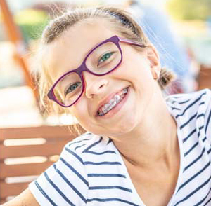 Young girl with glasses and braces