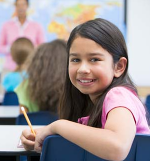 girl smiling in classroom